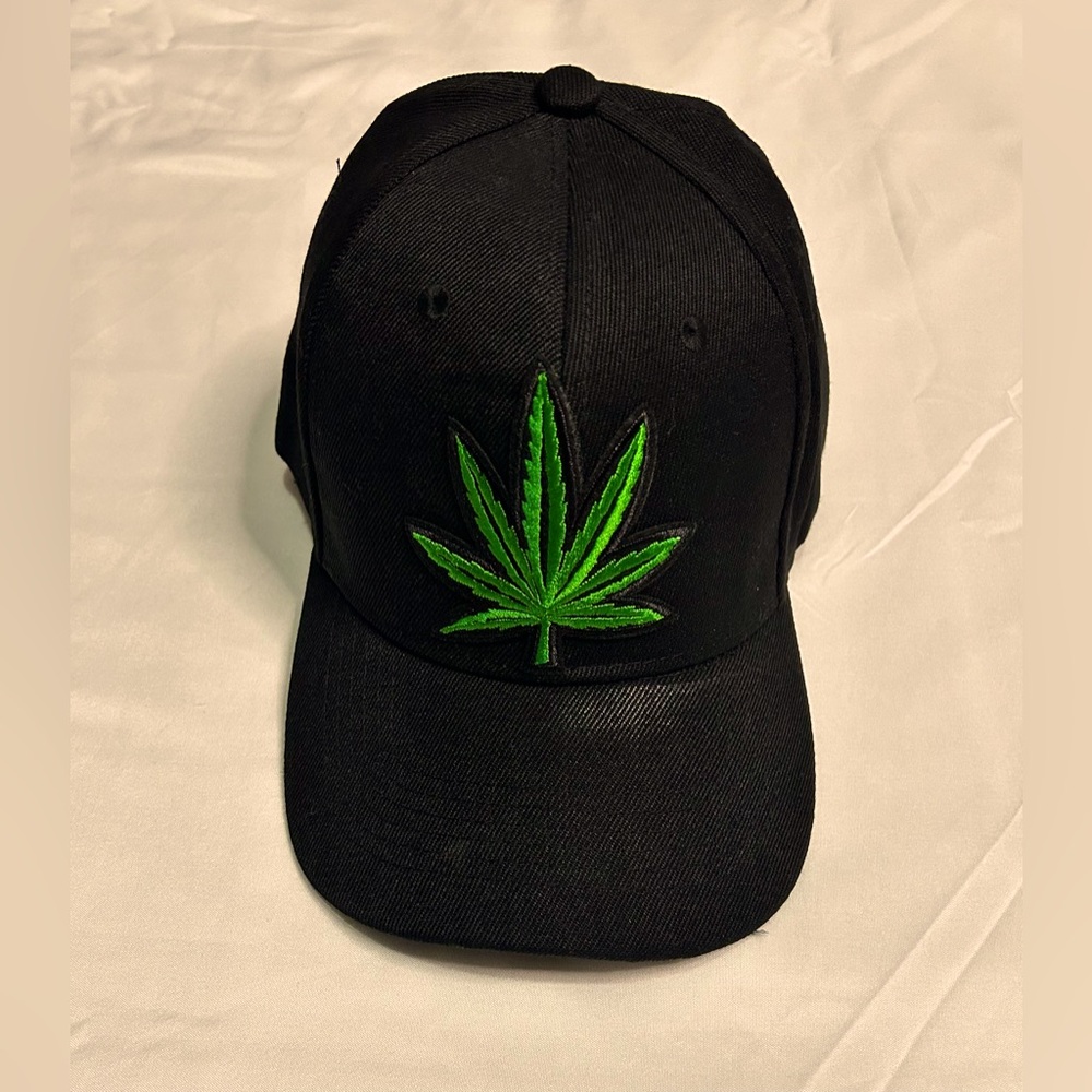 Black Baseball cap with A green Maple Leaf